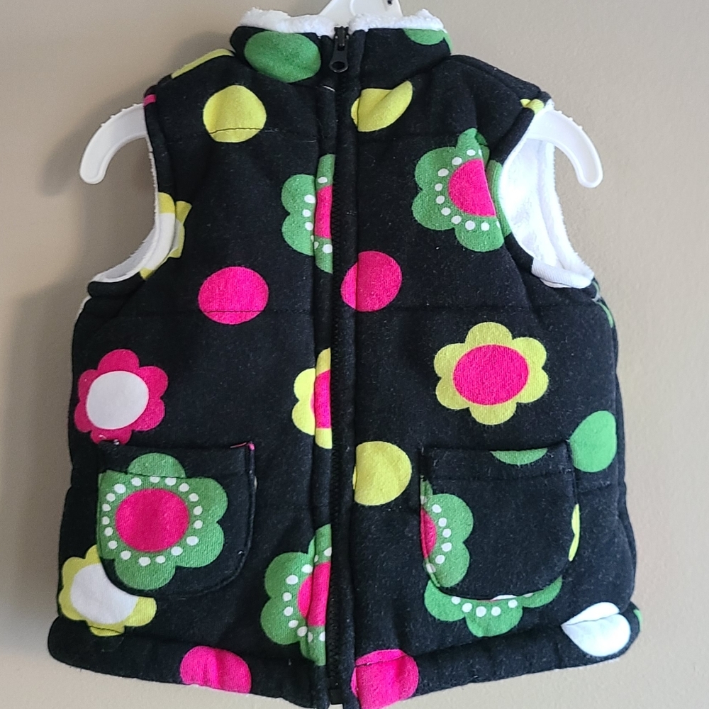 Warm girl's vest with bright floral print